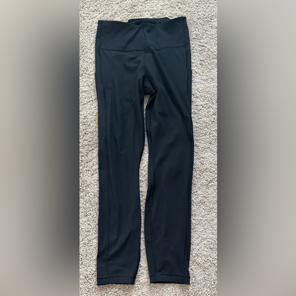 Athleta Elation black tights/leggings size Small with side pockets, 7/8 length